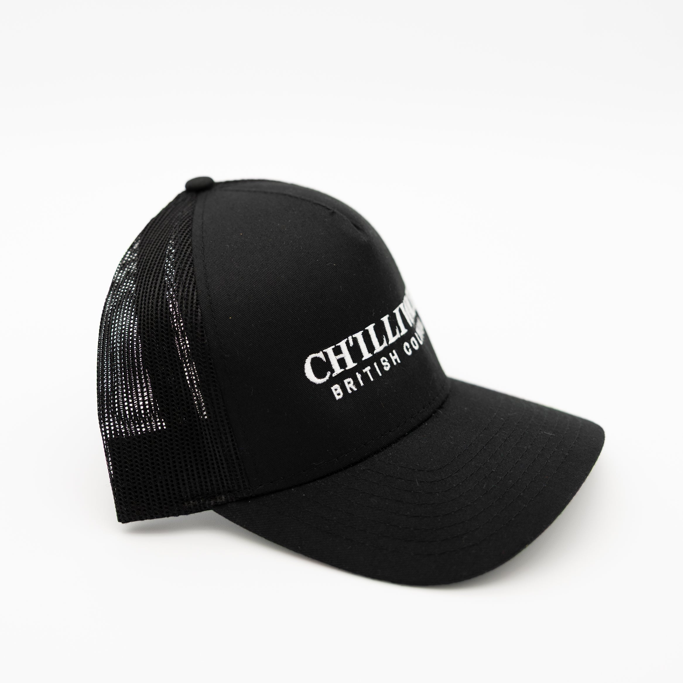 A black trucker-style baseball cap with white embroidered text reading 'CHILLIWACK BRITSH COLUMBIA' on the front, shown against a plain white background.