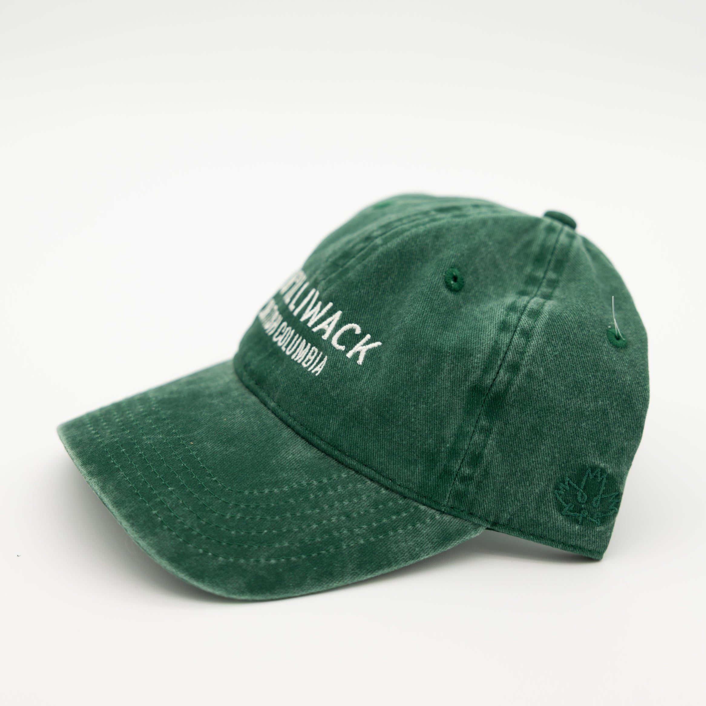 A green washed cotton baseball cap with white embroidered text reading 'CH'ILLIWACK BRITISH COLUMBIA' on the front, shown against a plain white background.